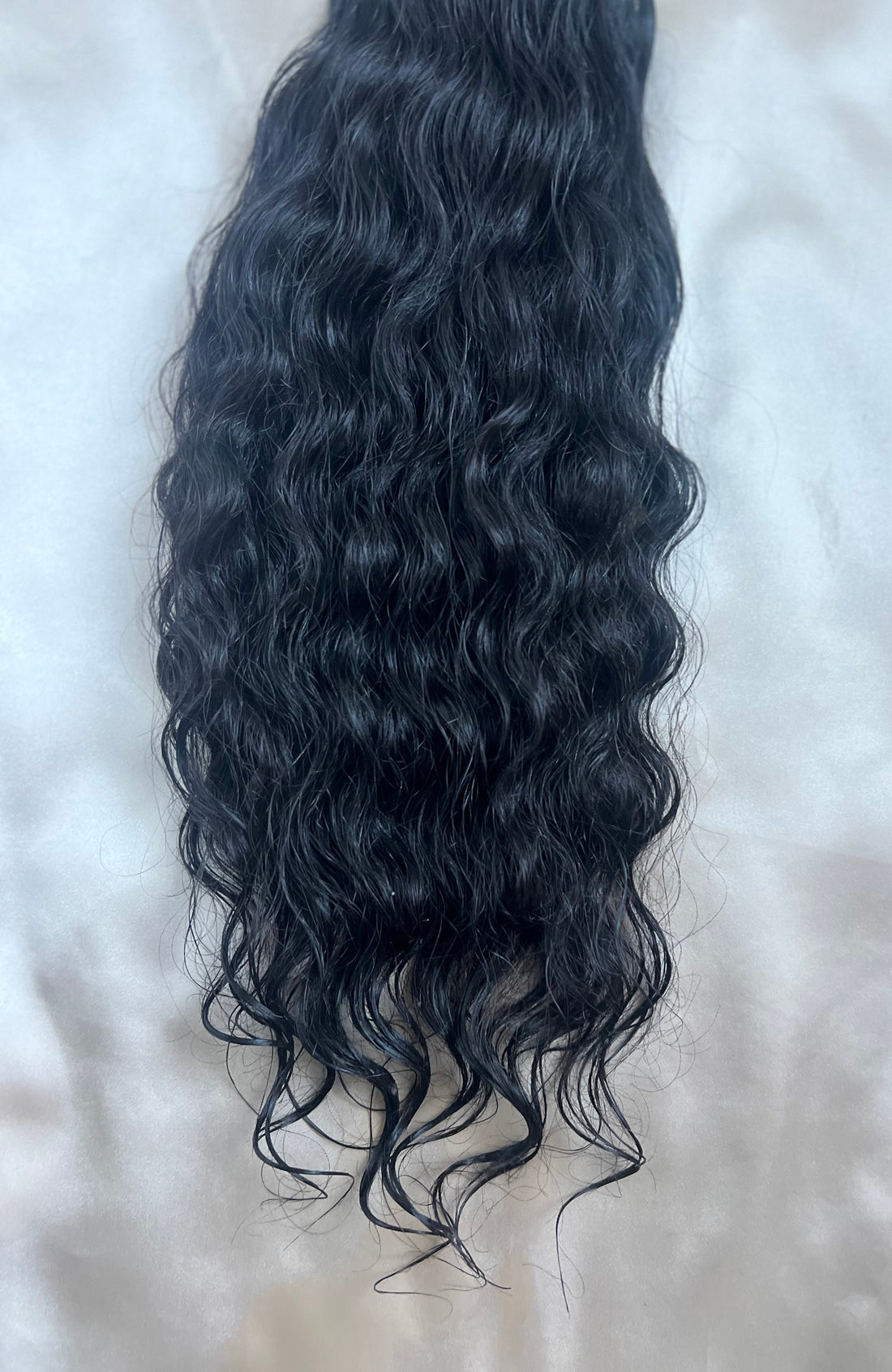 Raw Cambodian wavy hair showing natural texture and variation