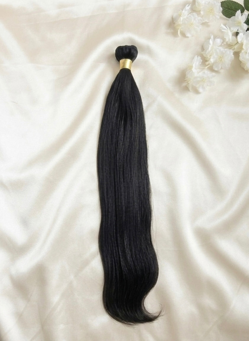 Raw Vietnamese Straight Bundle – Single Donor 100g of unprocessed human hair on a satin background.