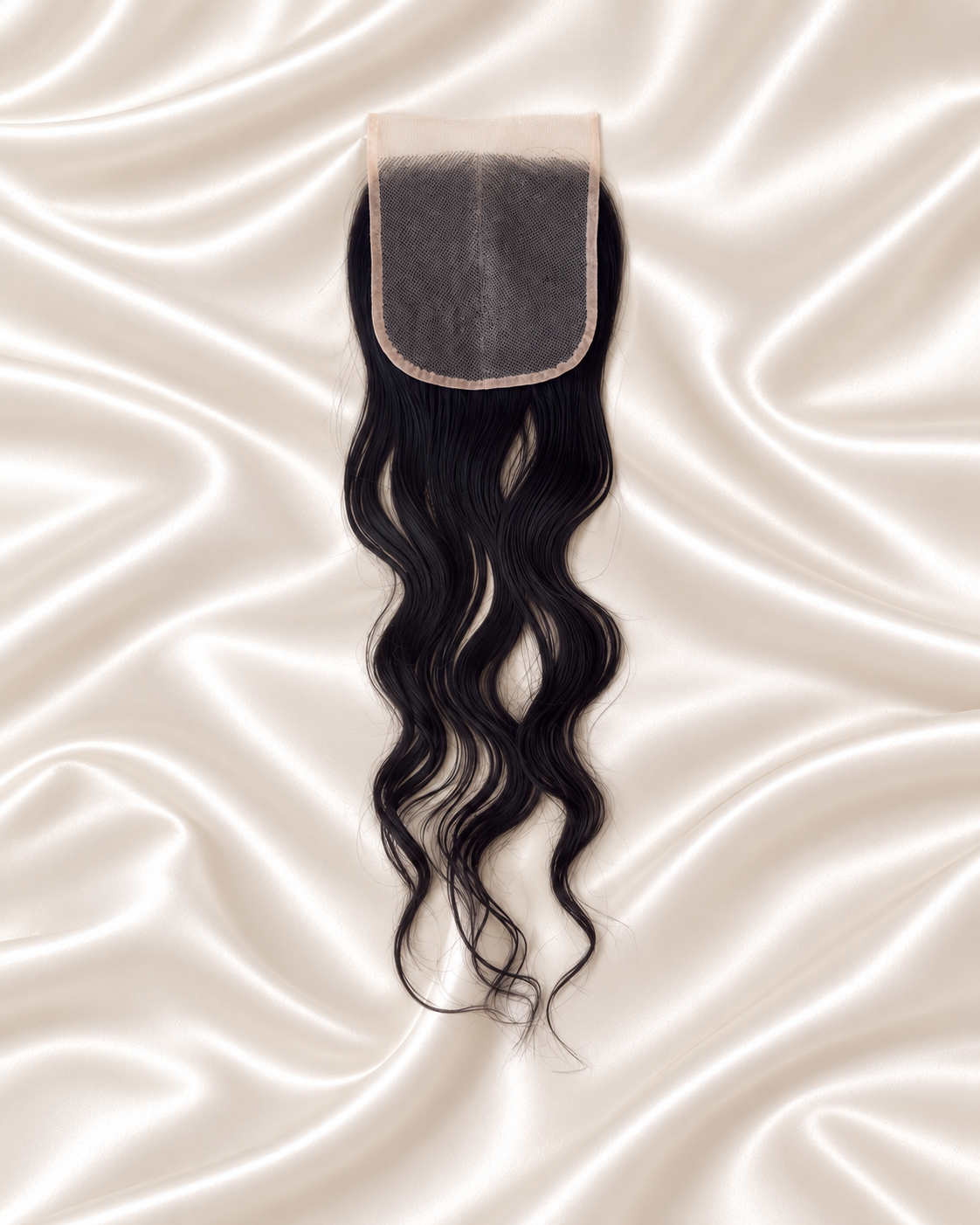 Raw Cambodian Wavy 5x5 HD lace closure on ivory satin backside.